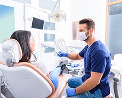 Dentist and patient talking in dental office