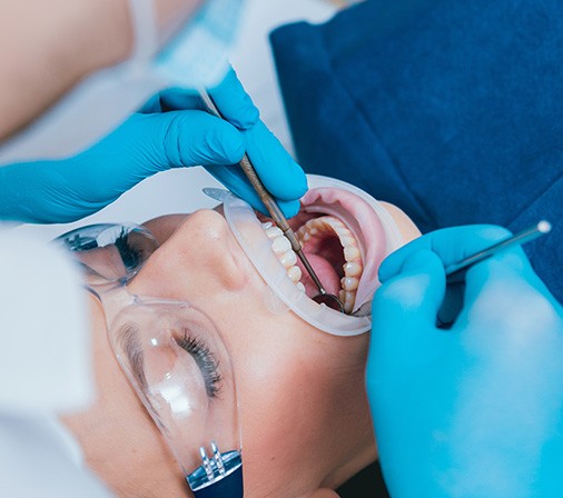 Closeup of dentist working on patient's teeth